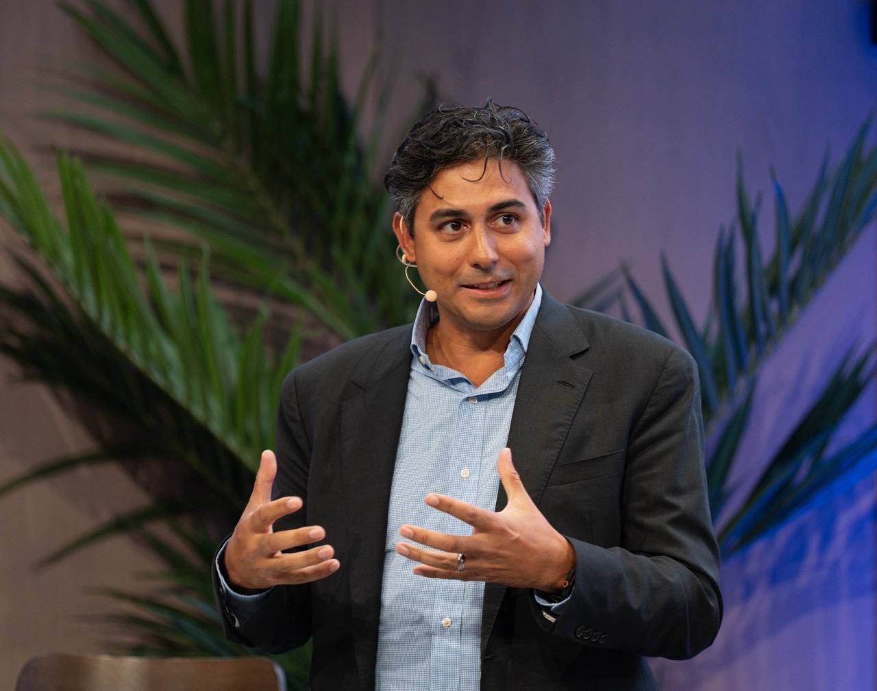 Charles Holive speaking on stage